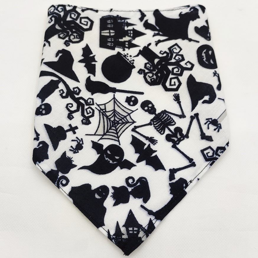 Pet Tie-Dye Triangle Bandana Scarf for Dogs & Cats in black and white Halloween-themed pattern featuring skeletons, bats, spiders, witches' hats, and haunted houses.