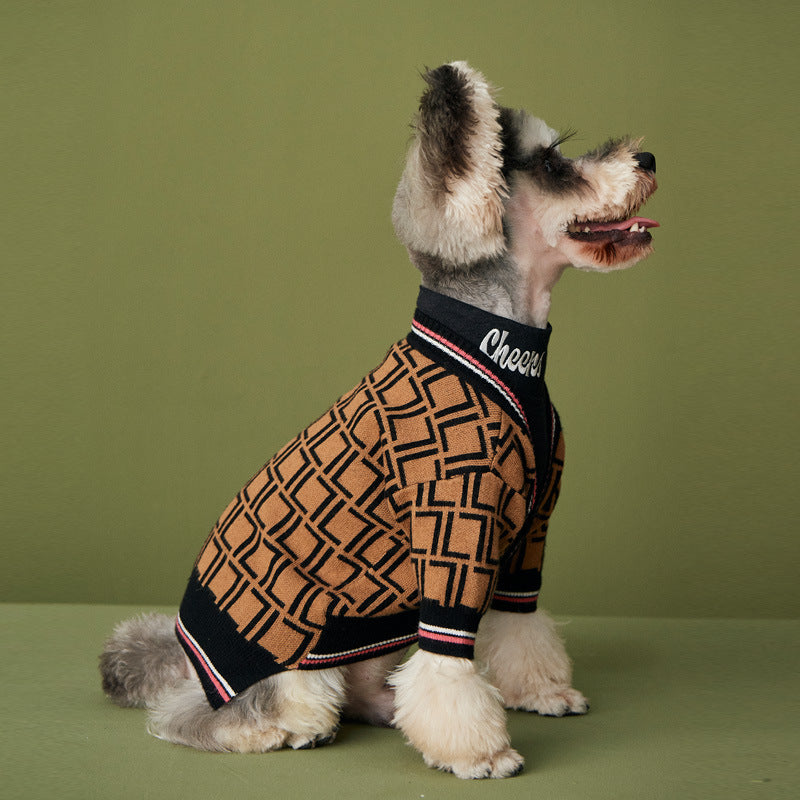 Small dog wearing a patterned brown and black knit sweater with a high collar that reads "Cheers," showcasing the Dog Sweater – Cozy High-Collar Knit Wool Sweater for Small & Large Dogs.