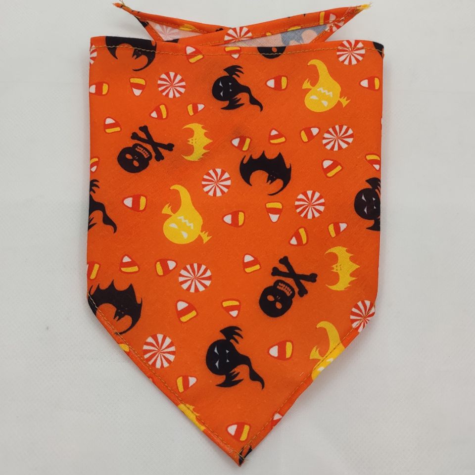 Orange Halloween-themed Pet Tie-Dye Triangle Bandana Scarf for Dogs & Cats featuring ghosts, bats, candy corn, and skulls on a vibrant background.
