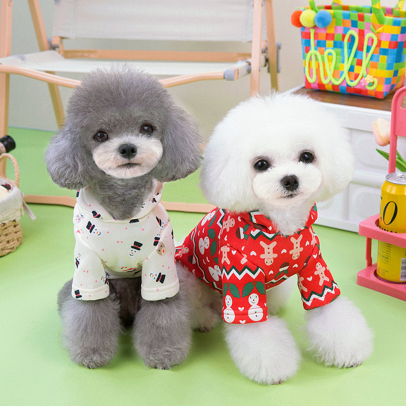 Two small dogs wearing Dog Christmas Sweatshirt | Festive Holiday Clothes for Dogs with holiday patterns, sitting indoors near colorful decorations and toys.