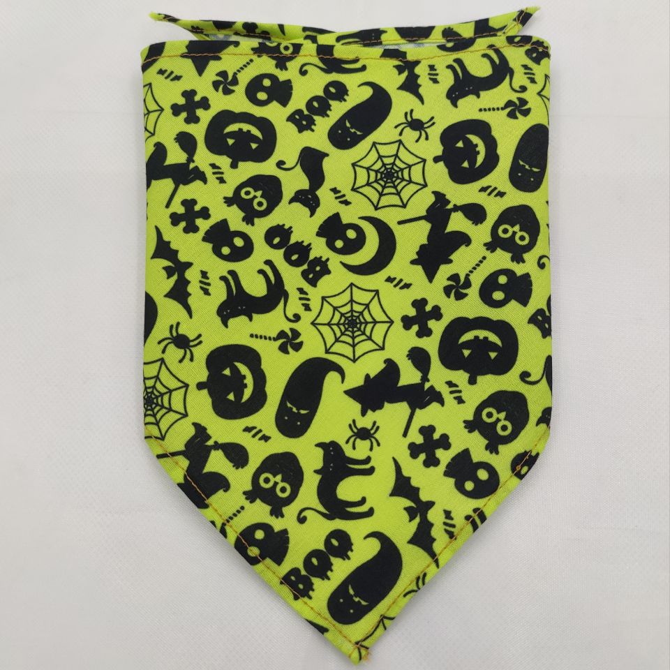 Pet Tie-Dye Triangle Bandana Scarf for Dogs & Cats in bright green with black Halloween-themed patterns including cats, bats, spiders, skulls, and webs, perfect for festive pet apparel.